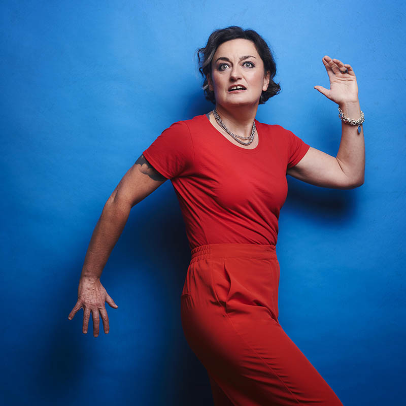 Photo of Zoe Lyons against a blue background