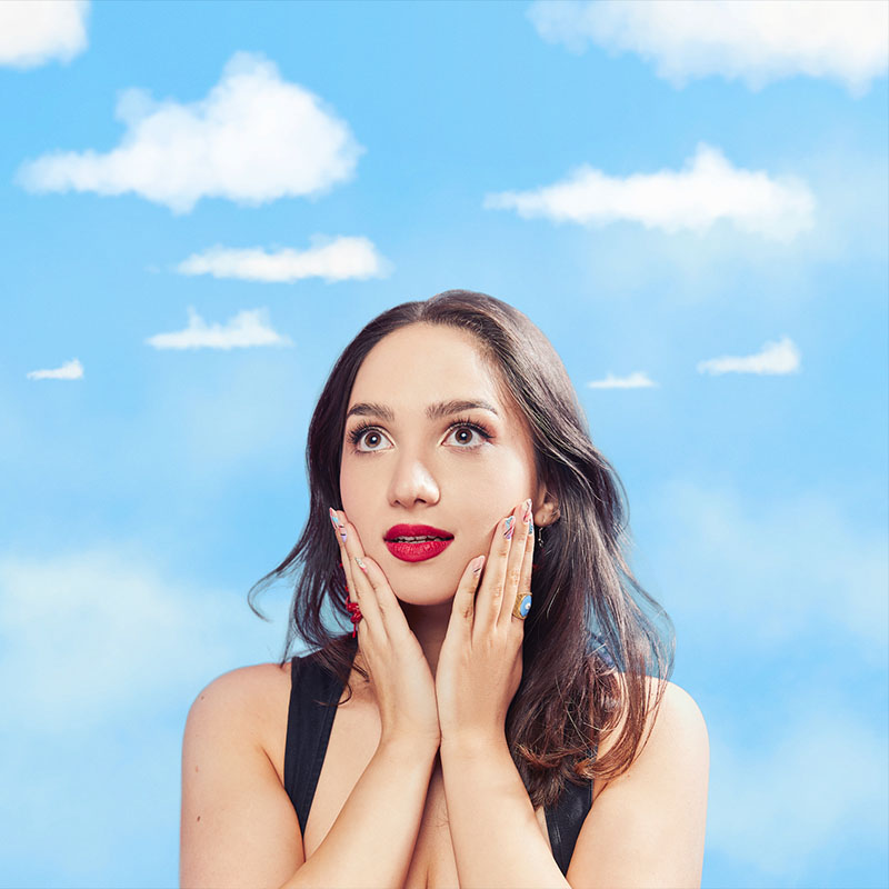 Photo of Bella Hull against a blue sky backdrop