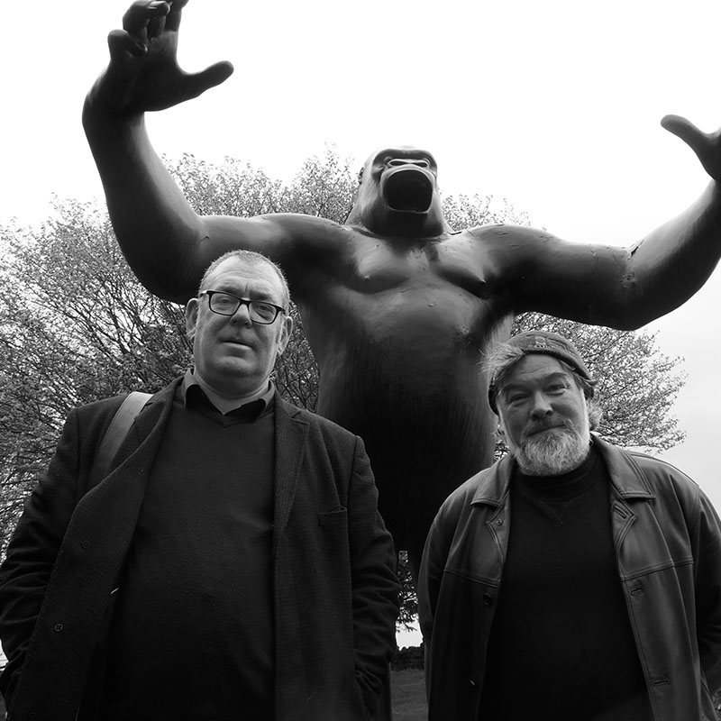 Photo of Robert Lloyd (The Nightingales) and Stewart Lee in front of a sculpture of King Kong