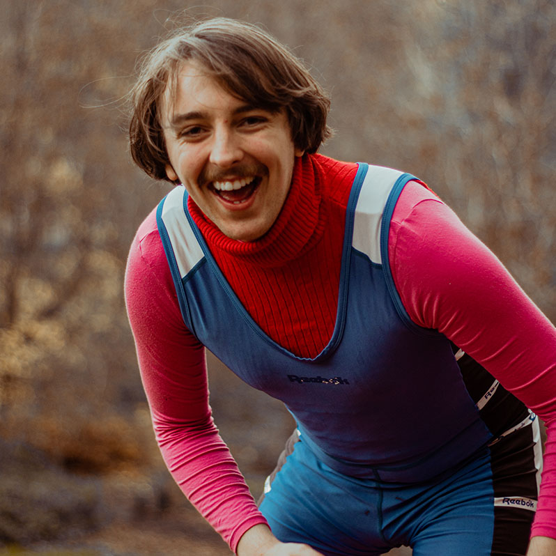 Picture of Jo Kent-Walters in blue dungarees, smiling