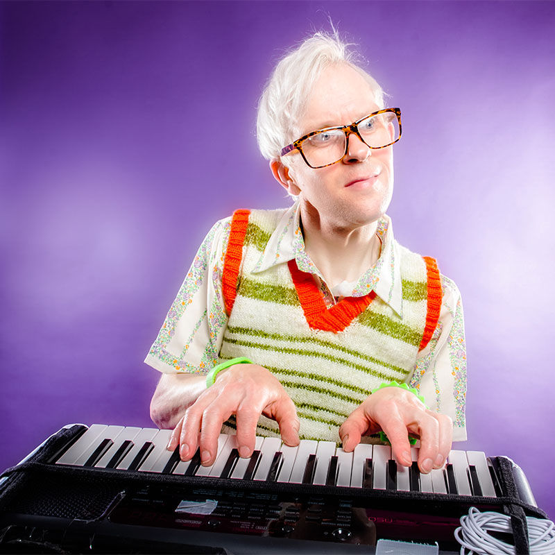 Photo of Robert White playing his keyboard